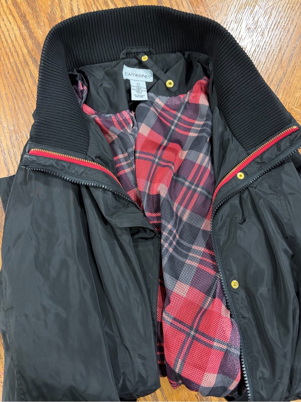 Catherines Black womans Puffer Jacket with Red Plaid Lining